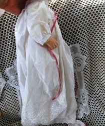 porcelain baby doll white gown side